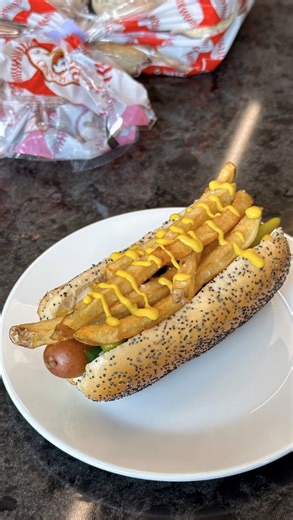 103K views · 1.4K reactions | Would you add this old-school favorite to your line-up on the 4th of July?... We highly recommend you do.  Vienna Beef dog stacked high with mustard, sport peppers, relish, and crispy French fries! Roaring 20’s Dog Recipe: https://turano.com/product/roarin-20s-hot-dog/ #turanobread #recipe #oldschoolchicagodog #4thofjuly #chicagosbread | Turano Baking Company | Facebook
