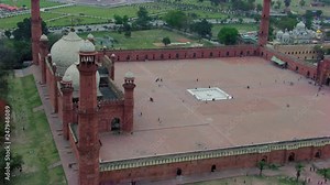 Lahore, Pakistan, Badshahi Mosque aerial view with Minar-e-Pakistan, Park of the Minar-e-Pakistan, Another side is a Gurdwara of Sikhs, Visitors ladies, gents and children are in the Mosque