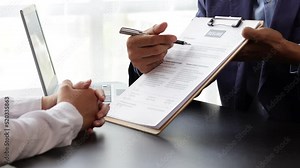 Manager in office discussing and interviewing job applicant for new employees. Submitting a job application and job interviewing.