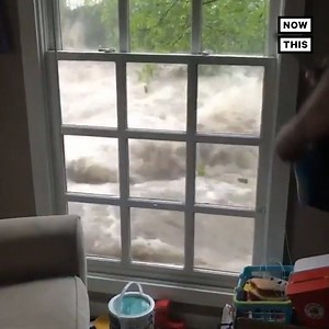 Watch the terrifying moment this family's home was surrounded by flood waters | NowThis