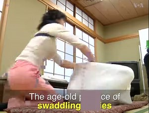 A new therapy where people are wrapped in large swaddling cloth is gaining traction in Japan. | Voice of America