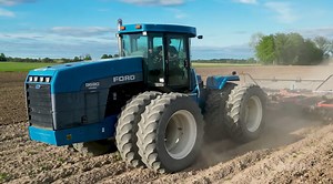 Working on spring tillage with a Ford Versatile 9680 4wd tractor. Powered by an 855 Cummins rated at 350 horsepower. Pulling a Case IH True Tandem 34' vertical tillage tool to prepare the field for planting.  Tractor Chasers