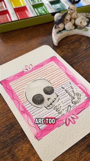Kristine Brown on Instagram: "Day 5 of Spooky Portraits 💀✌️ A watercolor skeleton in a pastel pink frame — because spooky can still be soft. Peace, love, and eternal rest. #SpookyPortraits #SkeletonArt #CuteCreepy #fluffypigeonart"