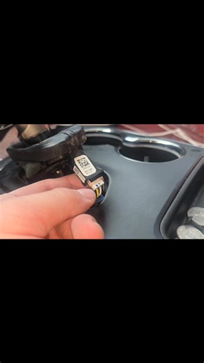 How to remove center console to remove dvd player Took the dvd player apart, found a quarter in it, dvd plays well now, no more scratches or not being able to put the cd in | Nick Bostic