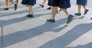 Slow motion : The Asian high school students in white uniform are walking in row to the classroom in the morning.