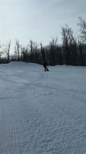I snowboarded through a diagonal handrail at Horseshoe Valley resort.