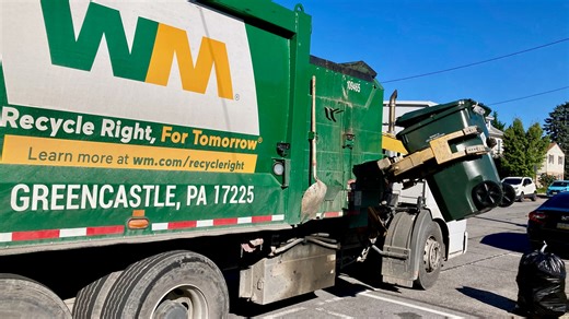 New Waste Management truck with mechanical arm on Hagerstown trash routes