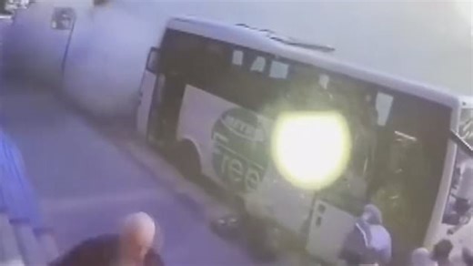 Pedestrians run from collapsing building in Istanbul