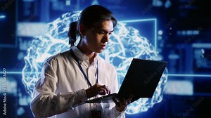 Capable IT contractor works with artificial intelligence computerized model simulating human brain. Tech support man looks at AI visualization of machine learning algorithms using pattern recognition