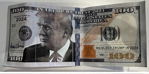 Counterfeit $100 bills featuring President Trump seen in circulation