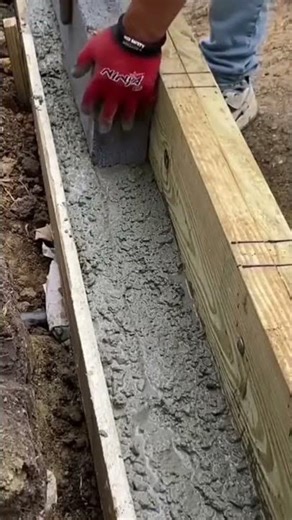 The process of installing a brick on the building area by a handyman neatly