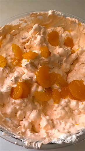 🍊 3 Step Orange Fluff Salad! 🙌 Light, sweet, creamy, and packed with nostalgic vibes—perfect for BBQs, potlucks, or just because! Ingredients ▢ 8 ounces frozen whipped topping, thawed ▢ 3 ounces jello orange gelatin mix ▢ 16 ounces full-fat cottage cheese, small or large curd ▢ 14 ounces mandarin oranges, drained ▢ 20 ounces crushed pineapple, drained ▢ 1 cup mini marshmallows Instructions 1. Combine the thawed whipped topping and orange gelatin powder together in a large bowl and stir until c