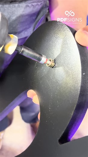 PDF Signs on Instagram: "➡️ Integrating pin screw threads inside our 3D CNC routedLED neon letters allows for precise stud alignment, secure mounting, and clean detachability during service. ⚙️This hardware method ensures structural stability, faster installs, and minimal wall disruption. 🤩 Here at PDF Signs located in Fort Lauderdale, we are always finding better was to do things to make the job a life bit easier for the next person. #3DLetters #SignFabrication #SignShop #Fabrication largeform