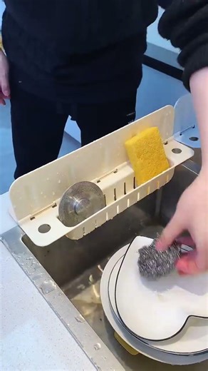 Place this suction-cup splash guard by your kitchen sink, and you can wash pots and dishes