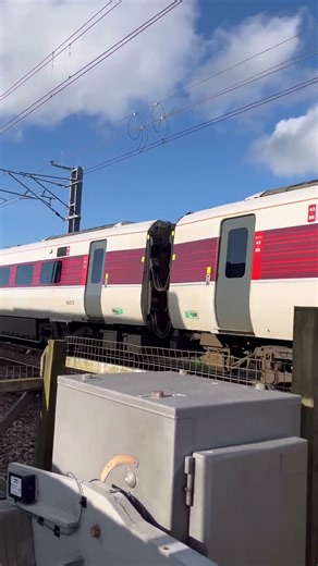 LNER Azuma Class 801 passing Wooden Gate Level Crossing
