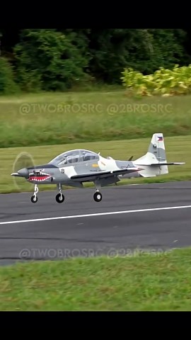 Super Tucano RC plane performs a precision touch and go landing