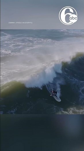 Surfers ride massive Hurricane Erin waves