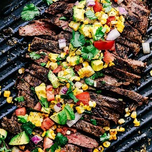 GRILLED GARLIC HERB FLANK STEAK WITH AVOCADO CORN SALSA PRINT HERE: https://therecipecritic.com/grilled-flank-steak/ "Our family all loved the flavor! And the avocado corn salsa is out of this world!" -Jenn | Tried and True Recipes