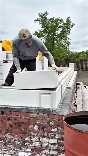 Laying Large White Blocks with Mortar for Structural Strength