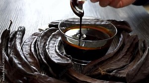 carob molasses and dry carobs together, along with carob syrup and dry carobs, carob syrup for human health,