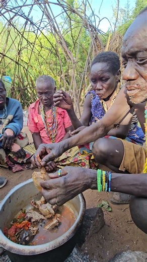 This bushman eating Heads of birds #bushman #africa #animals #food #bushlife #africawildlife #usa