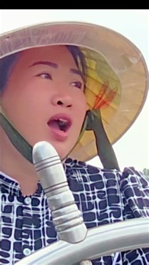 A Smiling Female Captain on the River Despite Hardship