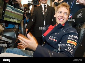 Hamburg, Germany. 30th May 2013. The German Formula 1 driver Sebastian Vettel races in a video simulator at a PR event in Hamburg, Germany, 30 May 2013. Photo: CHRISTIAN CHARISIUS Credit:  dpa picture alliance/Alamy Live News Stock Photo - Alamy