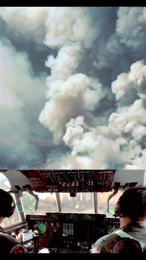California Air National Guard personnel and MAFFS (Modular Airborne Fire Fighting System) aircrew Maj. Nate Southwick and Capt. Tyler Henry, with the 115th Airlift Squadron, Channel Islands Air National Guard Station, follows a U.S. Forest Service lead plane as they perform a fire retardant drop from inside the flight deck of a MAFFS-equipped C-130J Super Hercules above the ‘Long Fire’ in Tulare County California, July 17, 2024. At the request of the National Interagency Fire Center, U.S. Northe