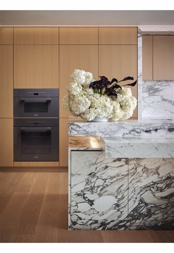 A kitchen holds more than any other room in the house, and you feel it when nothing is put away. The visual load is real. This one was designed around a single principle: hide everything that does not need to be seen, without sacrificing a single convenience. In an open concept space the kitchen is always on display, so the details that remain visible, the stone, the lines, the light had to be worth looking at. Clean by design, not by effort. . . #interiordesign #interiordesigner #kitchen #kitch