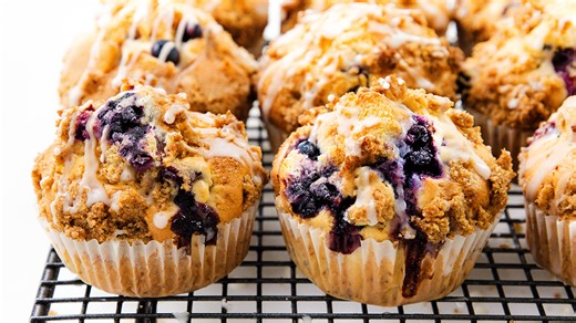 Soft blueberry muffins with crumb topping and glaze. Easy, quick, and bursting with flavor.