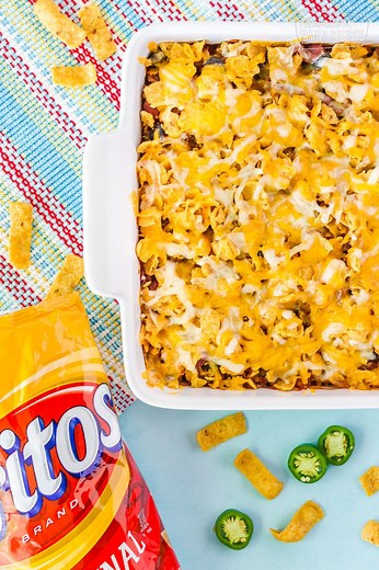Frito Chili Casserole is the perfect comfort dinner. Delicious layers of crunchy Fritos, Southwestern chili, and lots of gooey cheese make for a winning weeknight meal! https://www.favfamilyrecipes.com/chili-casserole/ | Favorite Family Recipes