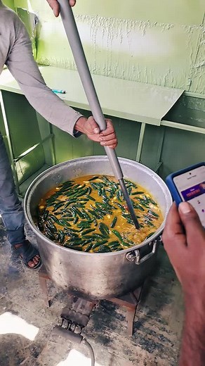Cooking Green Beans in a Traditional Metal Pot