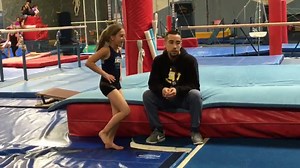 Taryn doing her round off backhandspring back tuck with coach Julio during spring camp. | Gymnastics World