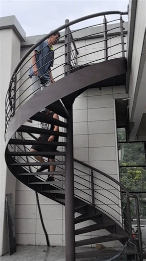 HuangWei on Instagram: "✨ Curves + style = perfect outdoor upgrade ✨ Our powder-coated black spiral staircase is a statement piece that’s built to last. Anti-slip steps, rust-resistant finish, and fully tailored to your layout. #OutdoorStaircase #ModernDesign #HomeRenovation"