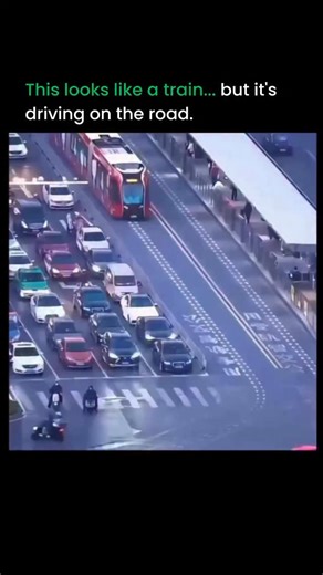 Artificial intelligence | Technology on Instagram: "What you’re watching looks like a train, but there are no tracks at all. This is China’s trackless tram system, also called ART. Instead of steel rails, it follows painted road lines using cameras, sensors, and GPS. From far away, it feels like a tram. Up close, it’s driving right on the street with cars. The idea is simple but powerful. You get tram level capacity without tearing up roads or spending years laying tracks. It’s electric, flexibl