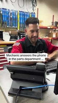 Mechanic answers phone in parts department …