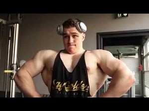 Young muscle bull puffing uff chest and flexing his upper body