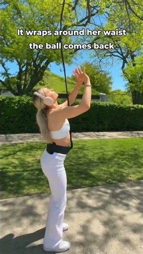 No wall at home for volleyball? It wraps around her waist and the ball comes back 🏐