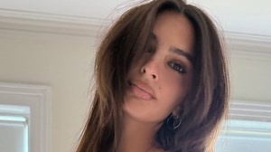 Emily Ratajkowski puts her bare bum on display in just a red thong