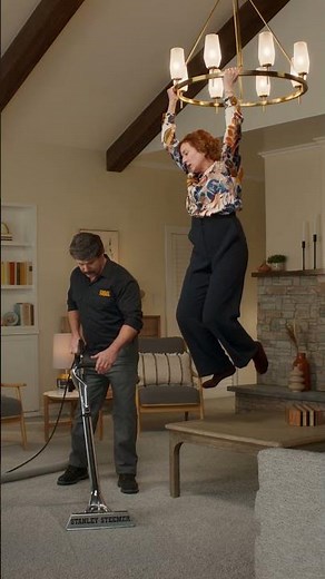 The Steemer cleans the carpet while the homeowner sings