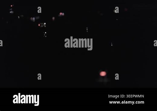 Concert crowd recording performance on smartphones. Dark silhouettes fill venue, creating moody nightlife atmosphere and shared experience Stock Video Footage - Alamy