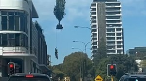 Union fury over construction worker lifted into air by crane