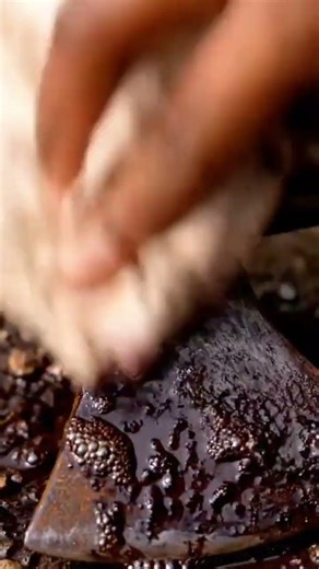 the process of cleaning rust on an axe using a rust-removing spray and liquid #popular #viralshorts