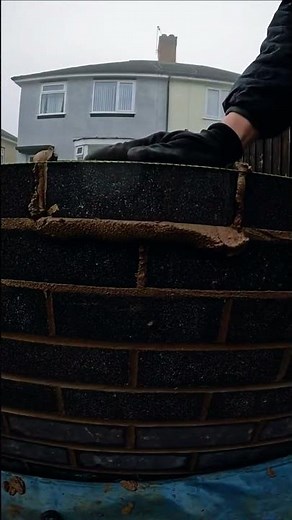 Building walls with black bricks for strong and stylish finish