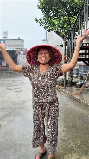 Old Mother Standing in the Rain 🌧️ A Rainfall That Refreshes the Soul | YouTube Shorts