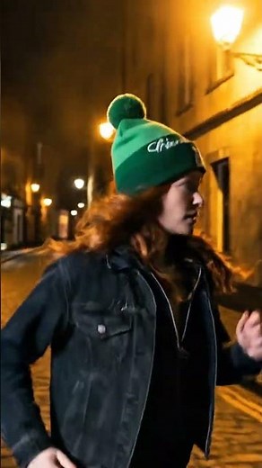 a beautiful irish red head woman wearing a green "Chaud Lapin" beanie, runnin in the street or Irela