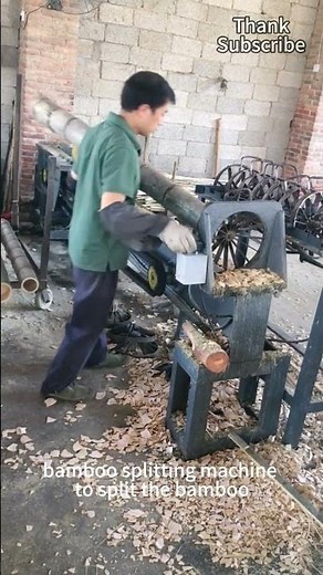 Workers push thick bamboo tubes into the bamboo splitting machine to split the bamboo quickly