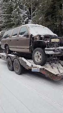 Using the 1981 K30 plow truck to pick up a Suburban for parts.