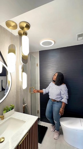 Moji Ojediran Interior Design | Home Decor | Lifestyle on Instagram: "Welcome to hubby’s man cave bathroom! From a basic basement bathroom to a man cave oasis! This basement bathroom renovation done by our @Angi’s pro is the perfect blend of style and functionality. With our pro expert craftsmanship and attention to detail, I can style the space just like that because we Angi that! 💃🏿 He’s so happy with how it all turned out and I think he’ll never leave the basement now! 😂 So, if you’re look