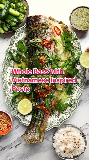 Seaside Deliciousness = Grilled Whole Fish with a Vietnamese-Inspired Pesto. My friend Nick (incredible chef and forager) caught this beauty - thanks for the fish Nick! The best dishes start with the best ingredients, and it doesn’t get fresher than this! Full Recipe Below! For The Fish 1 whole large fish, cleaned, scaled, and head removed (like Nick’s bass) 4 scallions, thinly sliced 1 - 2 red chilies, thinly sliced 1 - 2 tablespoon roasted crushed peanuts 2 tablespoons hot neutral oil ¼ cup fr